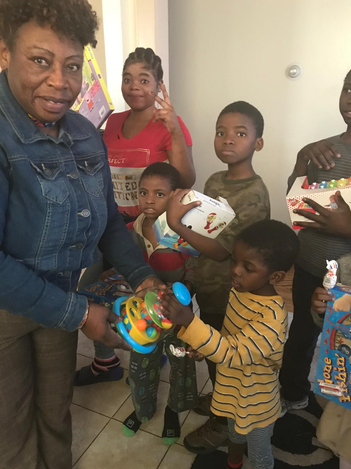 Jane kinity. giving kids Cristmas gift there home.
New haven