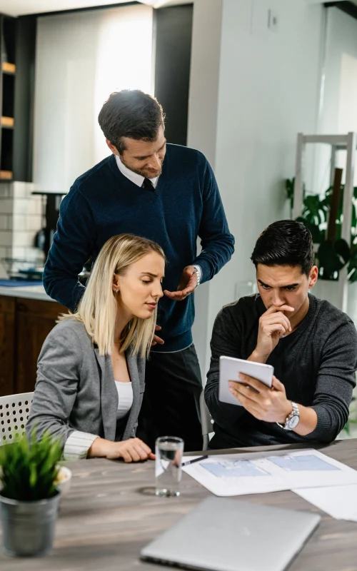 Business team reviewing loan documents