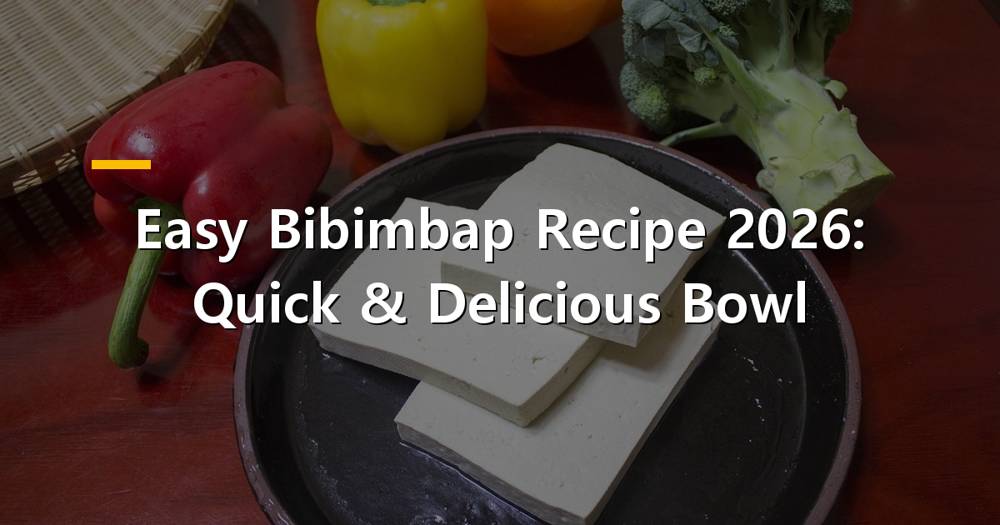 Colorful bibimbap bowl with various vegetables, meat, and a fried egg
