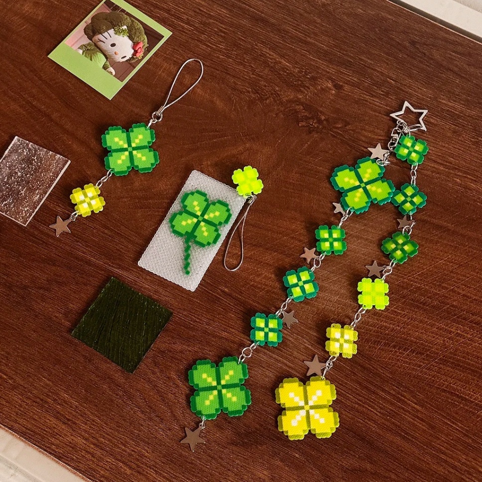 Bring a bit of luck to your everyday carry with a handmade Clover Perler Bead Strap. These pixel art charms come in two lengths to fit phone pouches, keys, or bags, offering a durable and nostalgic alternative to mass-produced accessories.