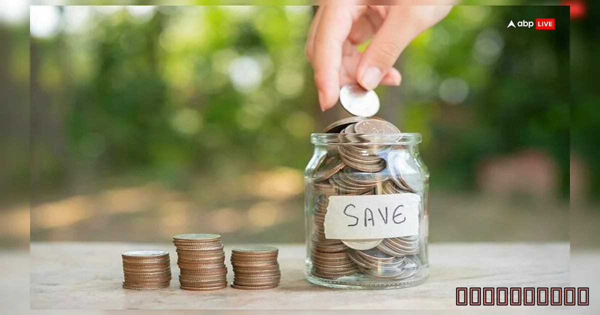  - A Person Putting Coins Into A Jar