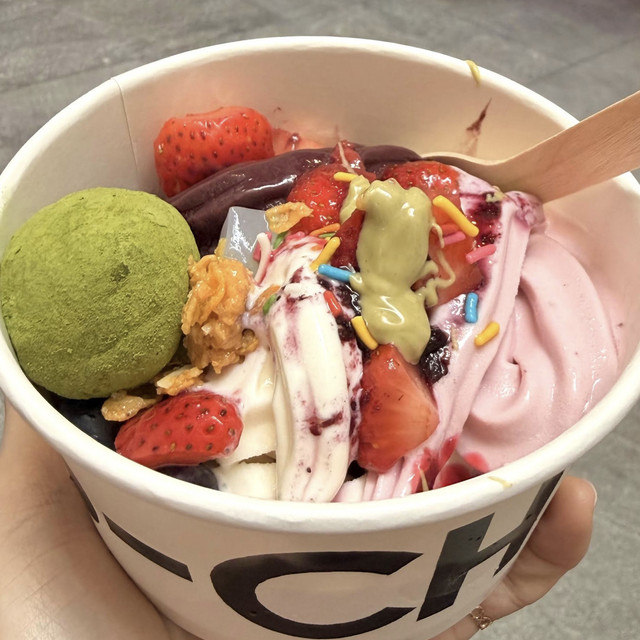 YO-CHI frozen yoghurt bowl with strawberries, chocolate sauce and assorted toppings